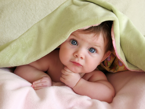 baby_under_green_towel